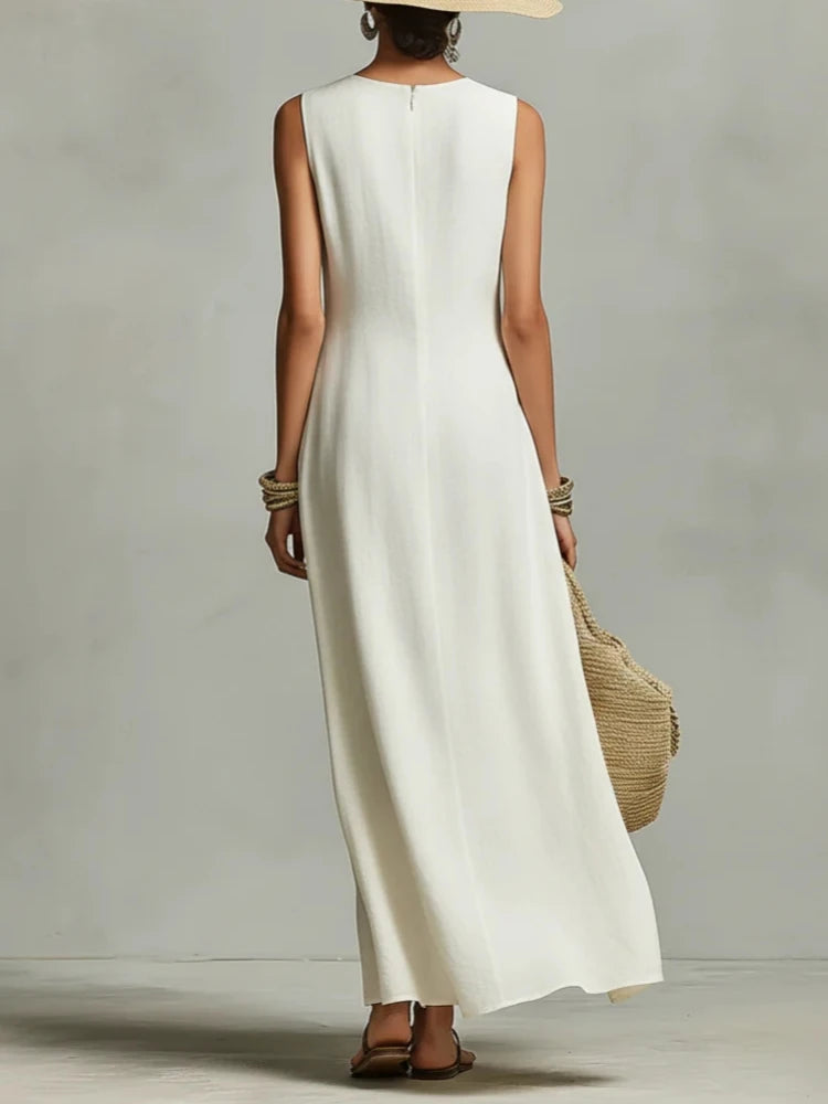 Light cream sleeveless maxi dress from back view with long, straight skirt hem